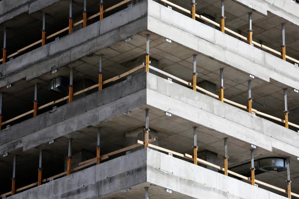 Corner of a concrete frame building with slab edges stacked in layers