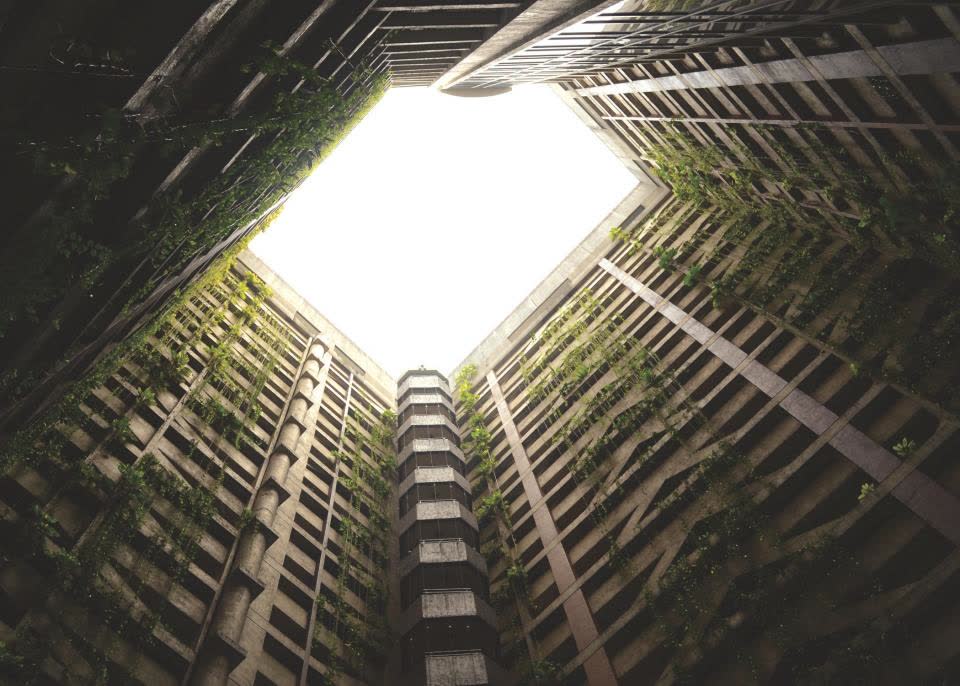 Looking up a concrete light well toward a bright square of sky